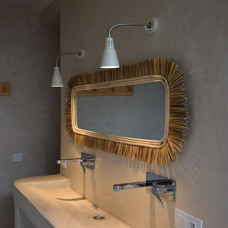 private suite room 5 Double sink with framed mirror and wall lights in the private suite room bathroom